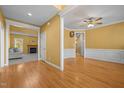 Open-concept living area with hardwood floors and white trim, showcasing the home's flow at 1420 Norwood Crest Ct, Raleigh, NC 27614