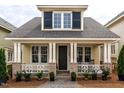 Charming home featuring a welcoming front porch, classic design, and neat landscaping for a cozy curb appeal at 2637 Sidford Aly, Raleigh, NC 27608