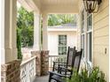 Cozy porch showcasing classic columns, comfortable seating, and decorative railings for an inviting outdoor space at 2637 Sidford Aly, Raleigh, NC 27608