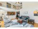 Bright living room featuring soaring ceilings, a balcony, and an open floor plan at 30155 Pharr, Chapel Hill, NC 27517