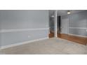 Spacious living room with plush carpeting, crown molding, and neutral paint at 39 Mcguire Ln, Clayton, NC 27527