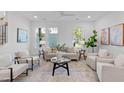 Bright living room featuring neutral furniture, large windows, and modern decor, creating a welcoming atmosphere at 5041 Lundy Dr # 102, Raleigh, NC 27606