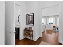 Welcoming hallway with hardwood floors leading to a bathroom and a living area at 620 Wade Ave # 505, Raleigh, NC 27605