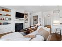 Cozy living room with fireplace, built-in bookshelves, and comfortable seating area at 620 Wade Ave # 505, Raleigh, NC 27605