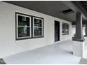 Inviting front porch with newly painted textured walls and framed windows at 722 Long Ave, Rocky Mount, NC 27801