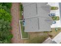Aerial view of townhome rooflines, fenced-in yard, and private driveways at 1048 Flagler St, Durham, NC 27713