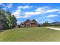 Charming two-story home featuring stone and brick architecture, enhanced by a lush, green lawn at 105 Somerley Dr, Garner, NC 27529