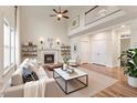 Bright living room with fireplace, high ceilings, hardwood floors, and ample natural light at 1817 Foxbrook Dr, Raleigh, NC 27603
