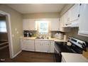 Bright kitchen features essential appliances, ample counter space, and a functional layout at 1910 Trexler Ct, Raleigh, NC 27606
