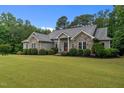 Beautiful home featuring stone details and meticulously kept landscaping, enhancing its overall appeal and charm at 2208 Wimberly Woods Dr, Sanford, NC 27330