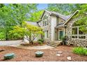 Lovely home exterior with stone accents, a small front yard tree, and inviting entrance steps at 2606 Sherbrooke Dr, Durham, NC 27712