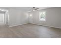 Bright living space with modern flooring and a white entry door at 2612 Glenbrook Dr, Durham, NC 27704