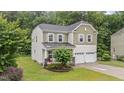 Charming two-story home with a two-car garage and beautifully landscaped front yard at 2709 Banks Lake Ct, Fuquay Varina, NC 27526