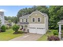 Charming two-story home with a two-car garage and beautifully landscaped front yard at 2709 Banks Lake Ct, Fuquay Varina, NC 27526