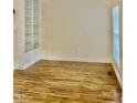 Bright living room featuring stylish wood floors and built-in bookshelves at 306 Fincastle Dr, Cary, NC 27513