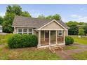 Attractive house with a cute porch, neat bushes, and a well-manicured front yard at 325 Martin Luther King Jr Blvd, Raleigh, NC 27601
