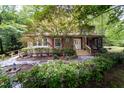 Two-story house with stone pathway, landscaped yard, and cozy screened porch at 4710 Rollingwood Dr, Durham, NC 27713