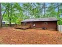 Spacious backyard with a wooden deck, perfect for outdoor entertaining and relaxation at 506 E E St, Butner, NC 27509