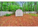 Backyard with storage shed, providing ample space for tools and equipment at 506 E E St, Butner, NC 27509
