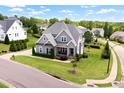 Aerial view showcasing the property's landscaping, street, and neighborhood at 5100 Schellinger, Raleigh, NC 27612