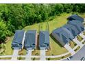An aerial view showcasing the backyard and the lush greenery surrounding this well-maintained community at 6036 Balance Ct, Raleigh, NC 27616