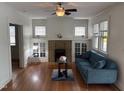 Inviting living room featuring a fireplace, hardwood floors, and ample natural light at 803 W Club Blvd, Durham, NC 27701