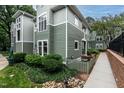 Attractive condo features a lush, landscaped yard with mature plantings at 1111 Parkridge Ln # 103, Raleigh, NC 27605
