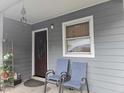 Inviting covered front porch with seating and a well-maintained exterior, offering a cozy entrance to the home at 118 Lynn Rd, Durham, NC 27703