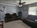 Comfortable living room with plush seating, ceiling fan, and neutral decor, creating a relaxing atmosphere at 118 Lynn Rd, Durham, NC 27703