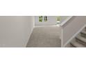 Spacious living room features neutral carpet and natural light at 1200 Solace Way, Rolesville, NC 27571