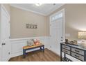 Bright foyer with a coat rack, decorative bench, and stylish decor at 1920 Bright Kannon Way, Wendell, NC 27591