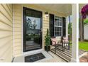 Inviting porch featuring stylish seating, a decorative door, and a 'Home Sweet Home' welcome mat at 1984 Sadler Ave, Creedmoor, NC 27522