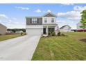 Charming two-story home with a manicured lawn, attached garage and welcoming front porch at 200 Gill Farm Way, Franklinton, NC 27525