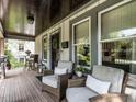 Cozy front porch with seating, wood flooring, and stylish decor at 2303 Byrd St, Raleigh, NC 27608