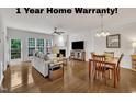 Open-concept living and dining area boasts hardwood floors, fireplace, and natural light at 2744 Laurelcherry St, Raleigh, NC 27612