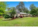 Beautiful home with well maintained front yard and professional landscaping in a park-like setting at 2805 Friendship Rd, Durham, NC 27705
