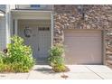 Charming townhouse with a stone front, a one-car garage, and nicely landscaped entrance at 2822 Pickett Rd # 132, Durham, NC 27705