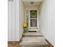 Cozy front porch with a charming wreath and a colorful chair at 310 Heidinger Dr, Cary, NC 27511