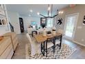 Spacious open-concept living room and dining area with modern finishes at 3225 Pelican Ln, Durham, NC 27703