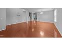 Open-concept living area boasts hardwood flooring and neutral paint at 3705 Rivermist Dr, Raleigh, NC 27610