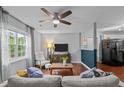Inviting living room featuring a ceiling fan and an open-concept layout at 3803 Jonesville Rd, Wake Forest, NC 27587
