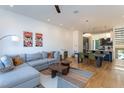 Open concept living and dining area, features hardwood floors, and modern decor at 414 Chavis Way, Raleigh, NC 27601