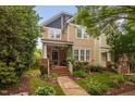 Charming two-story home featuring a welcoming front porch and beautifully landscaped front yard at 4409 All Points View Way, Raleigh, NC 27614