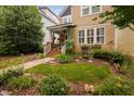 Charming two-story home featuring a welcoming front porch and beautifully landscaped front yard at 4409 All Points View Way, Raleigh, NC 27614