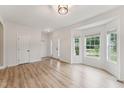 Bright entryway featuring wood floors, a bay window, and a welcoming front door at 50 Consella Way, Franklinton, NC 27525