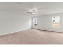 Spacious primary bedroom featuring carpet, white walls, recessed lighting, and two windows at 51 Crow Field St, Roxboro, NC 27574