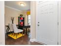 Welcoming entryway with hardwood floors and a view into a bright office space, creating an inviting first impression at 522 Finnbar Dr, Cary, NC 27519