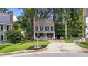 Charming two-story home featuring blue siding, white trim, black shutters and inviting front porch at 6717 Ebon Ct, Raleigh, NC 27615