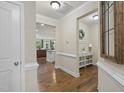 Welcoming entryway with hardwood floors and decorative features, leading to the living spaces at 707 Newlyn Dr, Raleigh, NC 27606