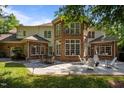 Beautiful backyard with stone patio, fire pit, seating, and multiple windows for natural light at 71012 Russell, Chapel Hill, NC 27517